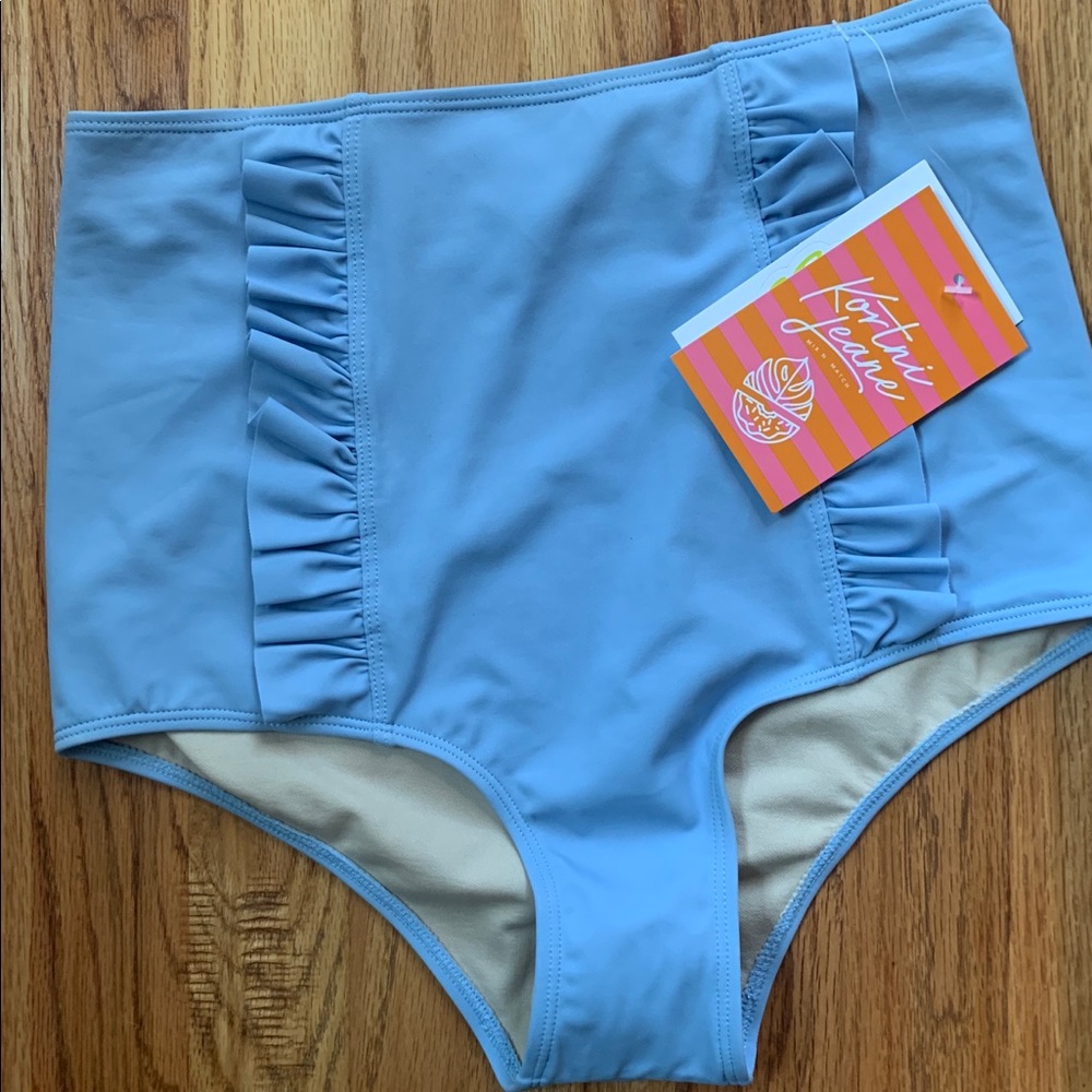 Small, powder blue ruffle front bottoms.